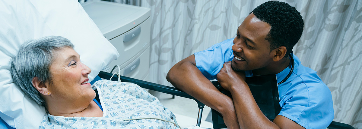 Nurse talking with an older patient