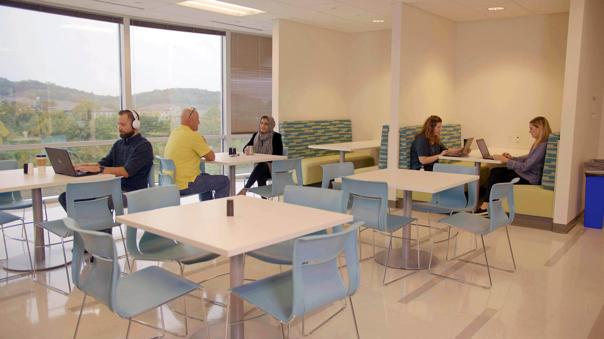 Medhost patients in waiting room, sitting.